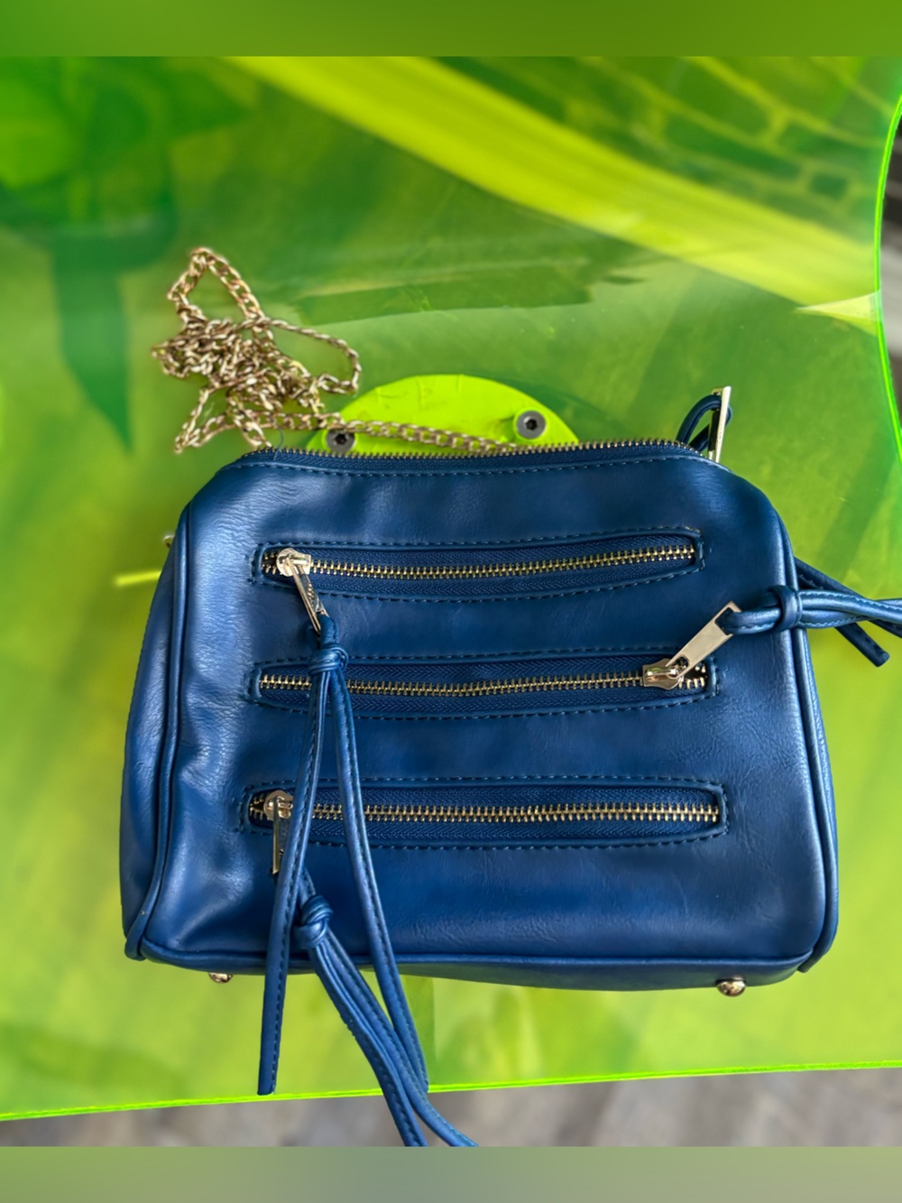Compact Blue Crossbody Bag with Gold Hardware